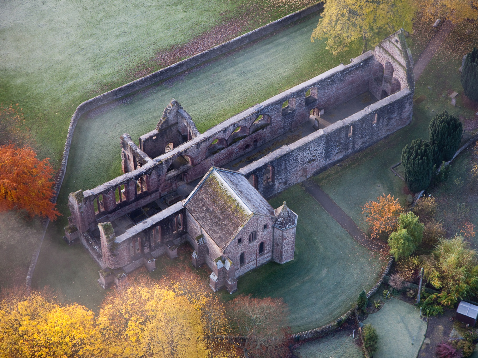 Beauly Priory ruins at dawn with morning mist