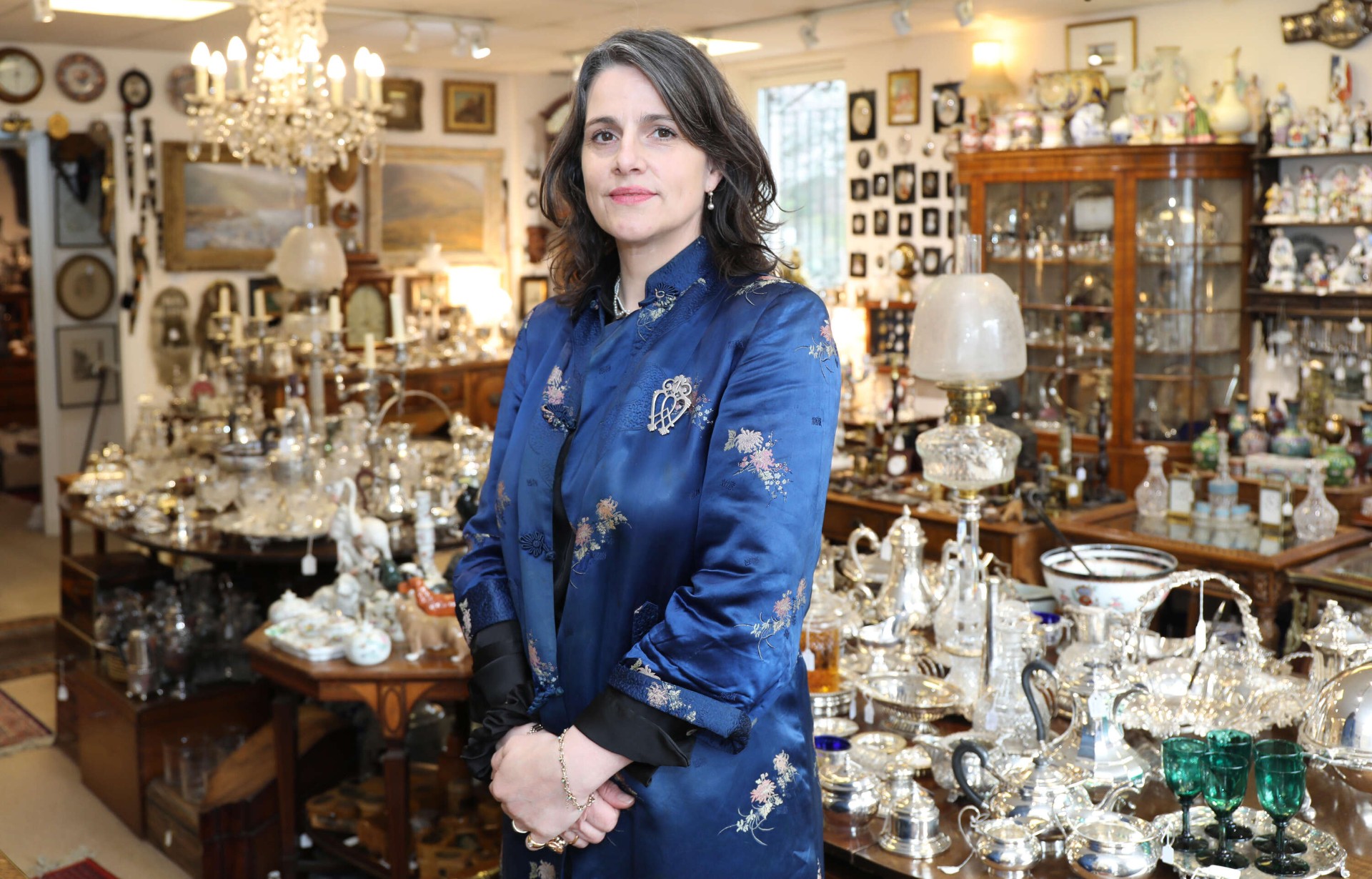 Iain Marr Antiques interior with silverware, chandeliers and fine antiques