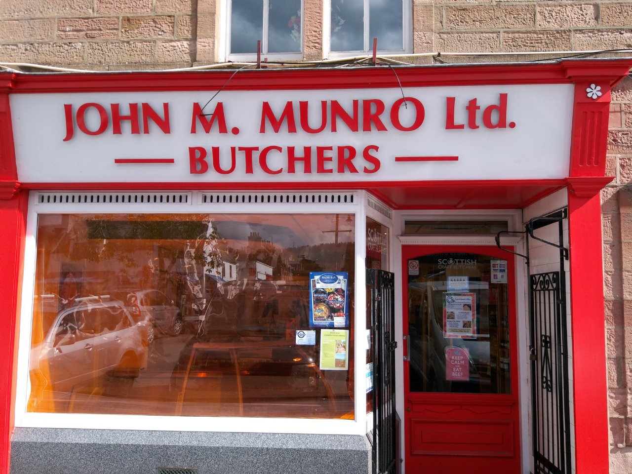 Munro's of Dingwall butcher shop window with traditional Scottish meats